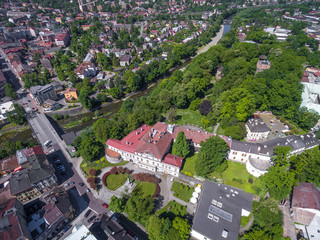 Aerial view of Cieszyn in Poland with bridge over river Olse. Border with Czech republic and Czech Tesin. The Hunting Palace, former rezidence of Habsburgs with park and tower