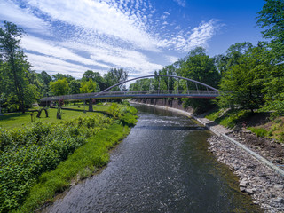 Aerial view of peasant bridge over river Olse between Cieszin and Czech Tesin. Border between Czech republic and Poland.