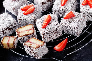 Sweet lamingtons: square cake with strawberry jam