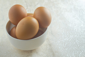 telur ayam or chicken eggs on white bowl. have good nutrition for the body. copy space