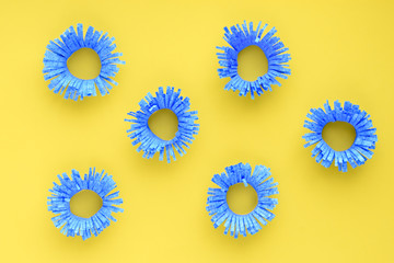 Pattern in the form of blue flowers on a yellow background. Children's creativity, tricks for Easter