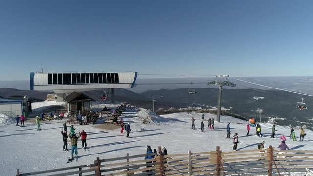 Snow mountain full of people skiing Bjelasnica