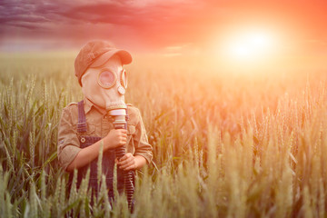 The child in the gas mask.  Concept of environment pollution and  natural disaster. Coronovirus...