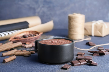 Cup of hot chocolate on table