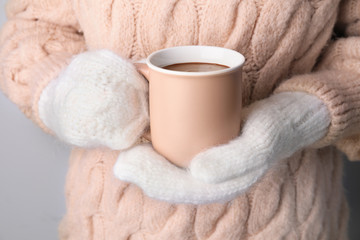 Woman with cup of hot chocolate, closeup