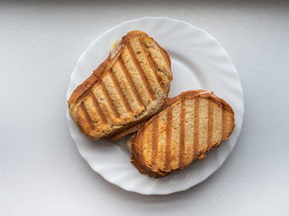 Grilled Zeon bread sandwiches on a white plate for a quick snack