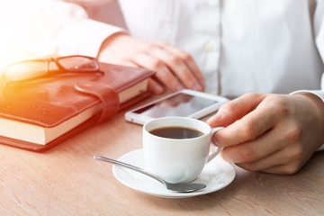 Businessman surfing internet on smartphone