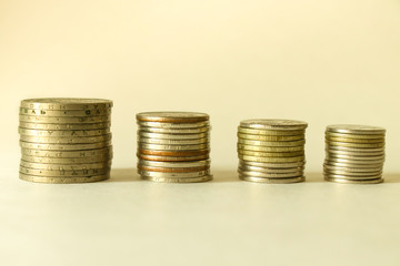 Stacks of coins on a white background. Savings. Planning.