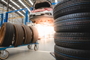 Sell tires at a tire store New tires are changing, comparing old tires with new tires.