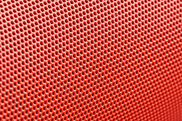 orange metal mesh in macro photography. background