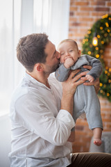 dad kisses his little son