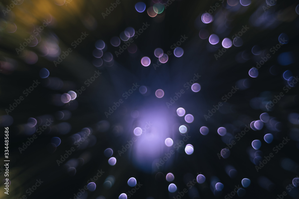 Poster Beautiful abstract purple bokeh collapse background on a dark.