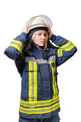 young serious women firefighter puts a helmet on his head.