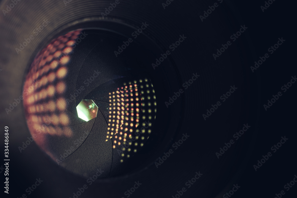 Poster close up beautiful camera lens on a black background. macro photography view..