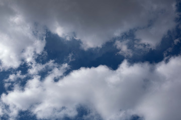 blue sky with gray clouds