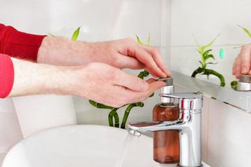 Man washing hands with soap. Bacteria infection protection by washing hands frequently.