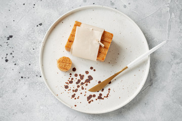 Russian pastila. Healthy raw vegan snack. Fruit  cake on the plate on a table. Sea buckthorn jam in a bowl. Dessert knife..