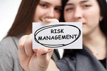 Business, technology, internet and network concept. Young businessman shows a keyword: Risk...