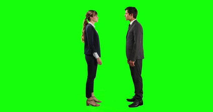 Side view of business people making a deal and shaking their hands with green screen