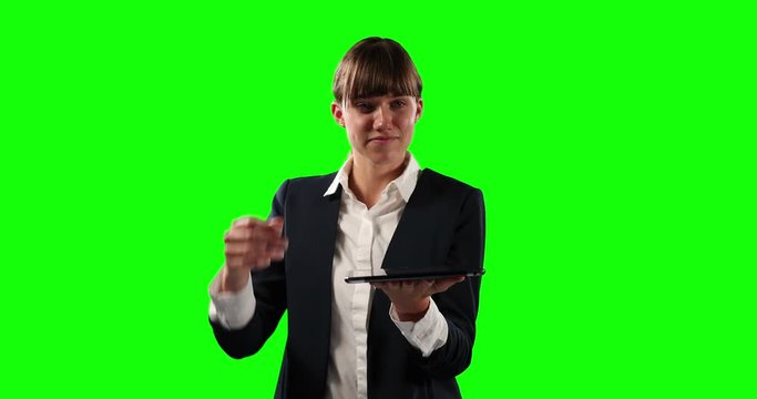 Front view of business woman holding a digital tablet with green screen
