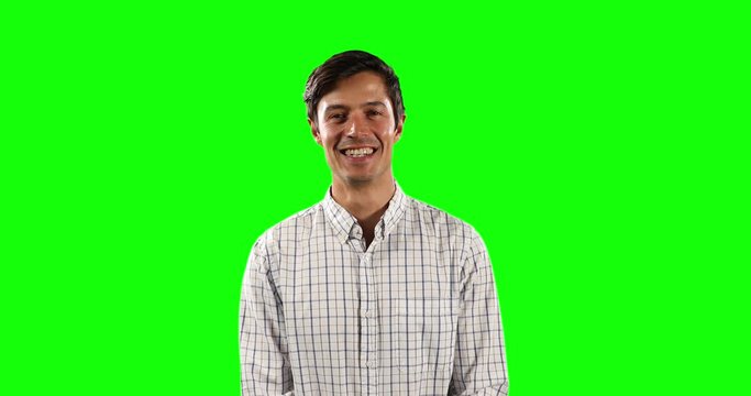 Front view of Caucasian man looking at camera with green screen