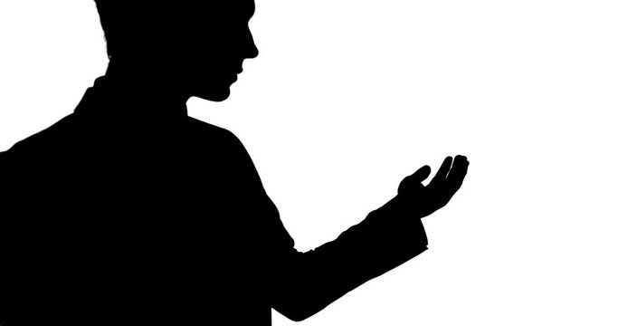Shadow of a Caucasian man holding his hand for a copy space with white background