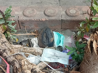 Used  health masks were left on unhygienic in the waste pile.
