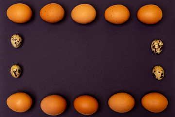 Easter eggs on a purple background, place for an inscription in the center