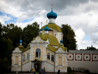 Russian Christian church, a temple on a background of gray sky and clouds.