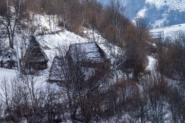 
Inhabited old house in the Apuseni Mountains in winter, Romania