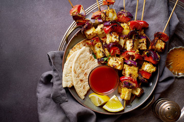 Paneer tikka starter kebabs with mint chutney and chapati. Traditional indian cuisine, grilled...