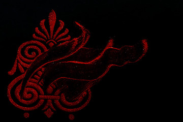 Distorted rangoli design with copy space on black background. dhanteras concept