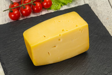 Hard yellow tasty cheese brick