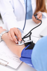 Female doctor arms make medic procedure closeup. Physical cure arterial beat exam tool nurse...