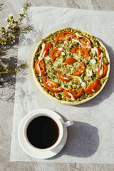 Vegetable pie with spinach, broccoli and tomatoes. Vegan cuisine.