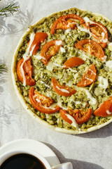 Vegetable pie with spinach, broccoli and tomatoes. Vegan cuisine.
