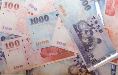 Background of New Taiwan Dollar 1000 and 100. Spread of Taiwanese dollar note.