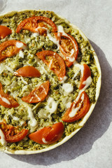 Vegetable pie with spinach, broccoli and tomatoes. Vegan cuisine.
