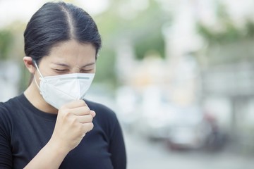 Women protect themselves by wearing a mask to prevent the virus. Covid 19