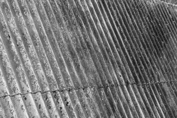 slate roof covering, wavy roof sheets to limit moisture and other rainfall into the building.