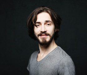 lifestyle and people concept:young man has excited expression, dresssed casually