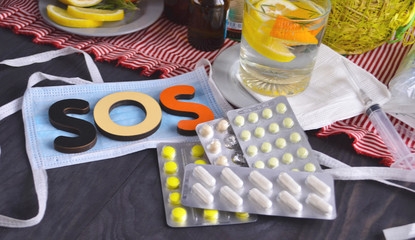 Pills and antiseptics of pharmaceutical medicine. Food to protect immunity. The concept of medicine, hygiene and healthcare. Coronavirus. top view, copy space. Face mask, surgical mask. Flu season.