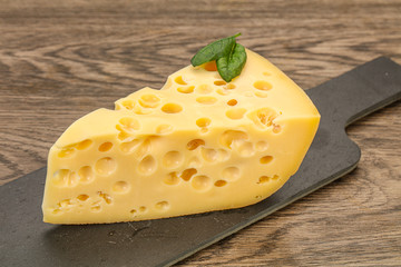 Maasdam cheese - yellow triangle with holes