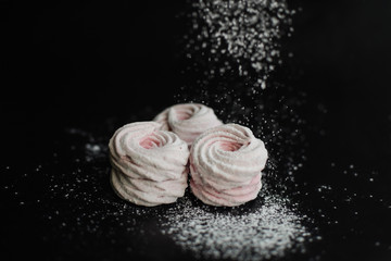 sweet marshmallows on a dark background