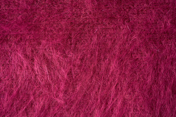Fototapeta premium Closeup red texture of woolen knitted fabric. Pattern of red fabric.