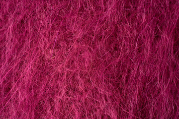Fototapeta premium Closeup red texture of woolen knitted fabric. Pattern of red fabric.