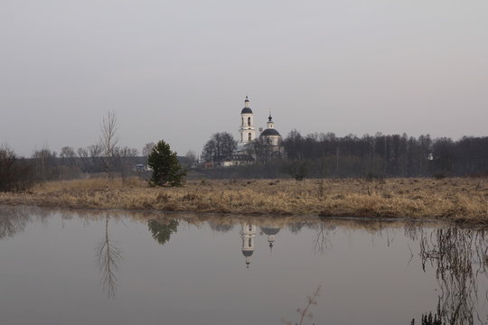 Grey Landscape With The Church And Its Reflection In The River