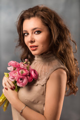 Portrait of young woman with beautiful professional makeup and f