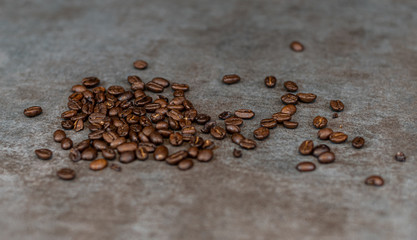 Coffee beans on grey background