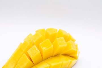 Yellow  mango slice with cubes isolated white background